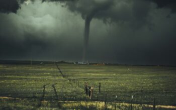 Photo: Unsplash (stock) — representative stormy sea, not this cyclone