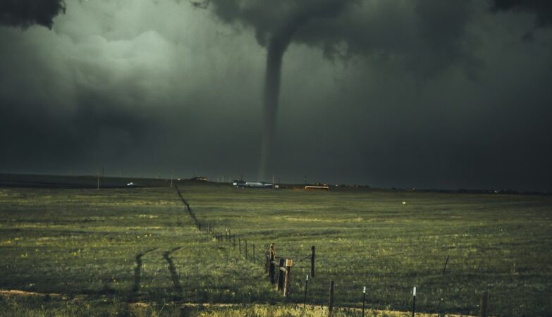 Photo: Unsplash (stock) — representative stormy sea, not this cyclone