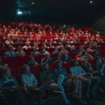 Cinema seats and movie theatre interior representing box office success