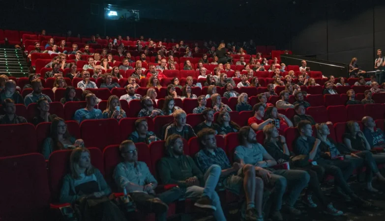 Cinema seats and movie theatre interior representing box office success