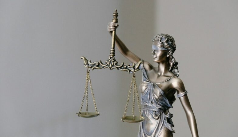 Photo: Unsplash (stock) — representative justice imagery, not this case