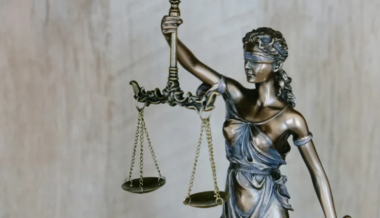 Court gavel and law books representing a judicial verdict